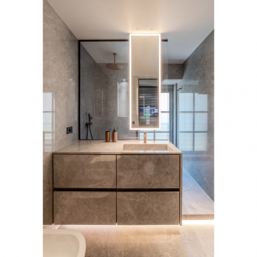 Bathroom view with textured cladding and integrated lighting
