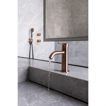 View of the washbasin with Toki faucet and coordinated shower area in the background