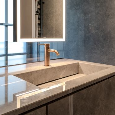 Stone-clad washbasin with Toki mixer by Radomonte