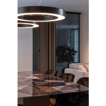 Detail of the stone table with illuminated suspended lamps