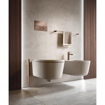Wall-mounted Filo toilet brush with Graffiti texture, matching the bidet mixer, flush plate and towel rail.