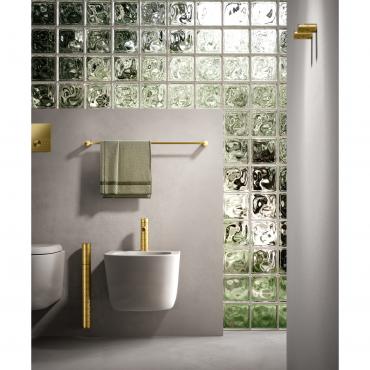 Wall-mounted Filo toilet brush in Gold with Graffiti texture, matching the bidet mixer, flush plate, towel rail and wall hooks.