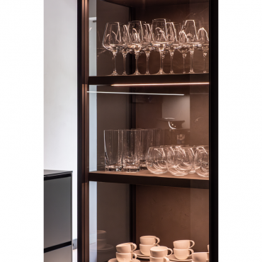 Detail of the illuminated display cabinet with glass shelves